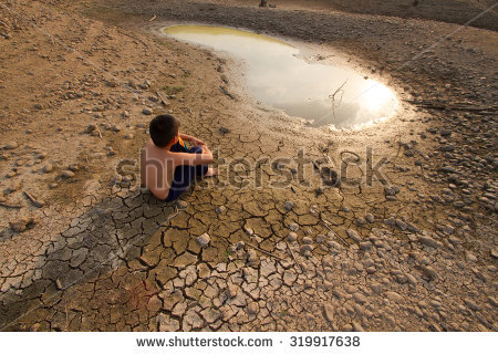 stock-photo-water-crisis-child-sit-on-cracked-earth-near-drying-water-319917638.jpg