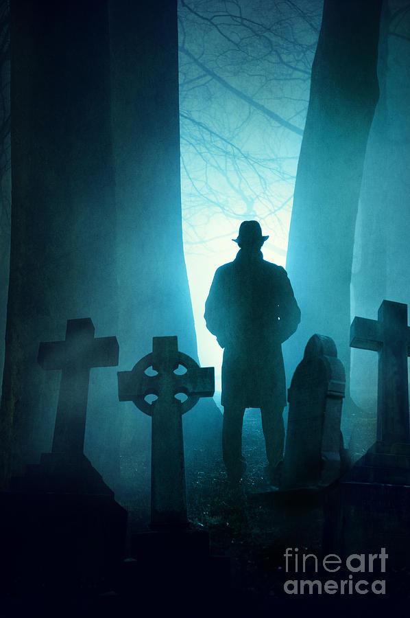 sinister-man-in-silhouette-in-a-foggy-graveyard-at-night.jpg