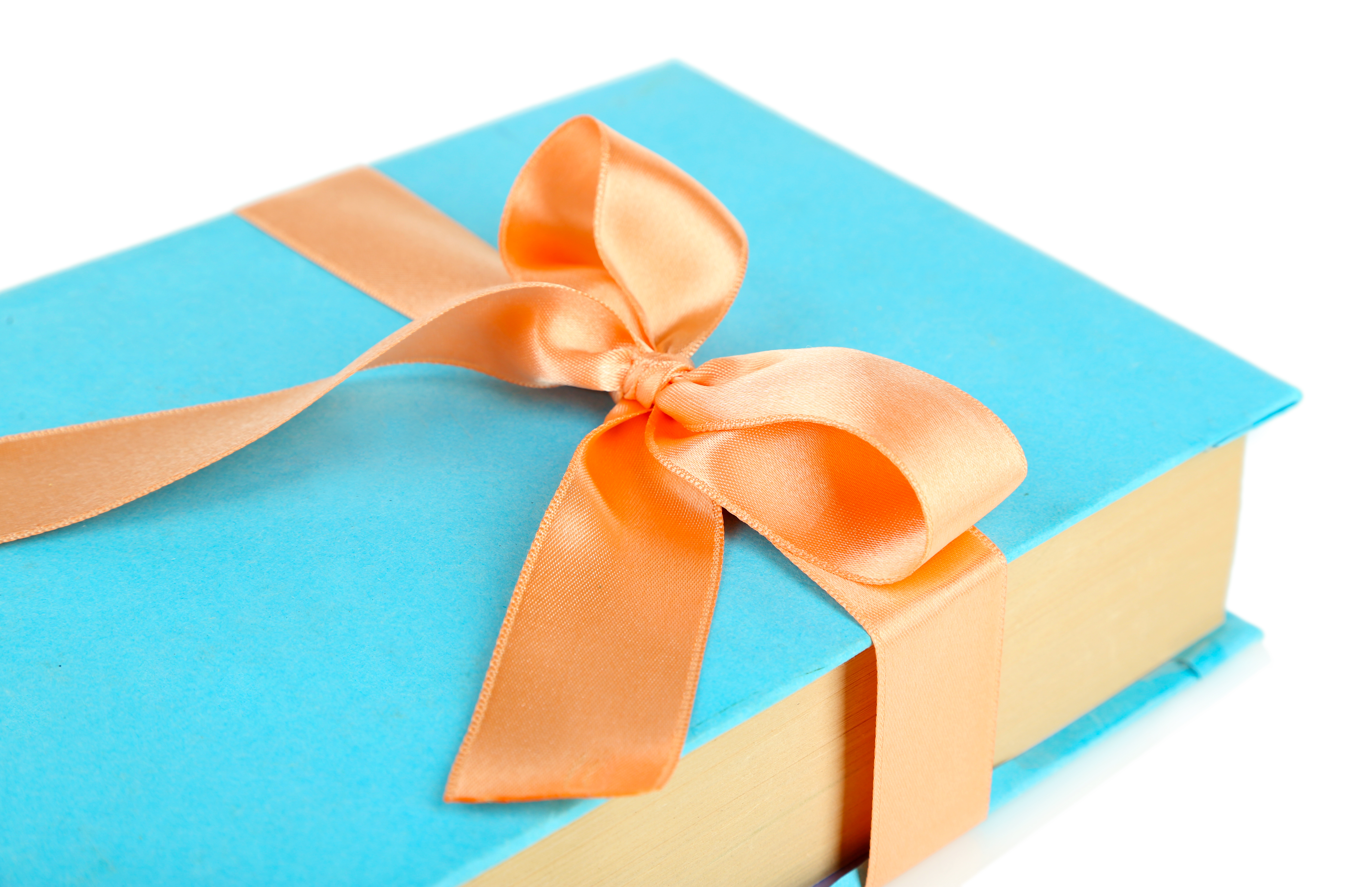 bigstock-Book-wrapped-with-color-ribbon-54081421.jpg