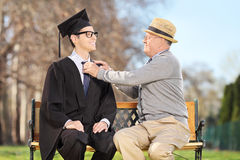 father-preparing-his-son-graduation-park-seated-wooden-bench-39123475.jpg