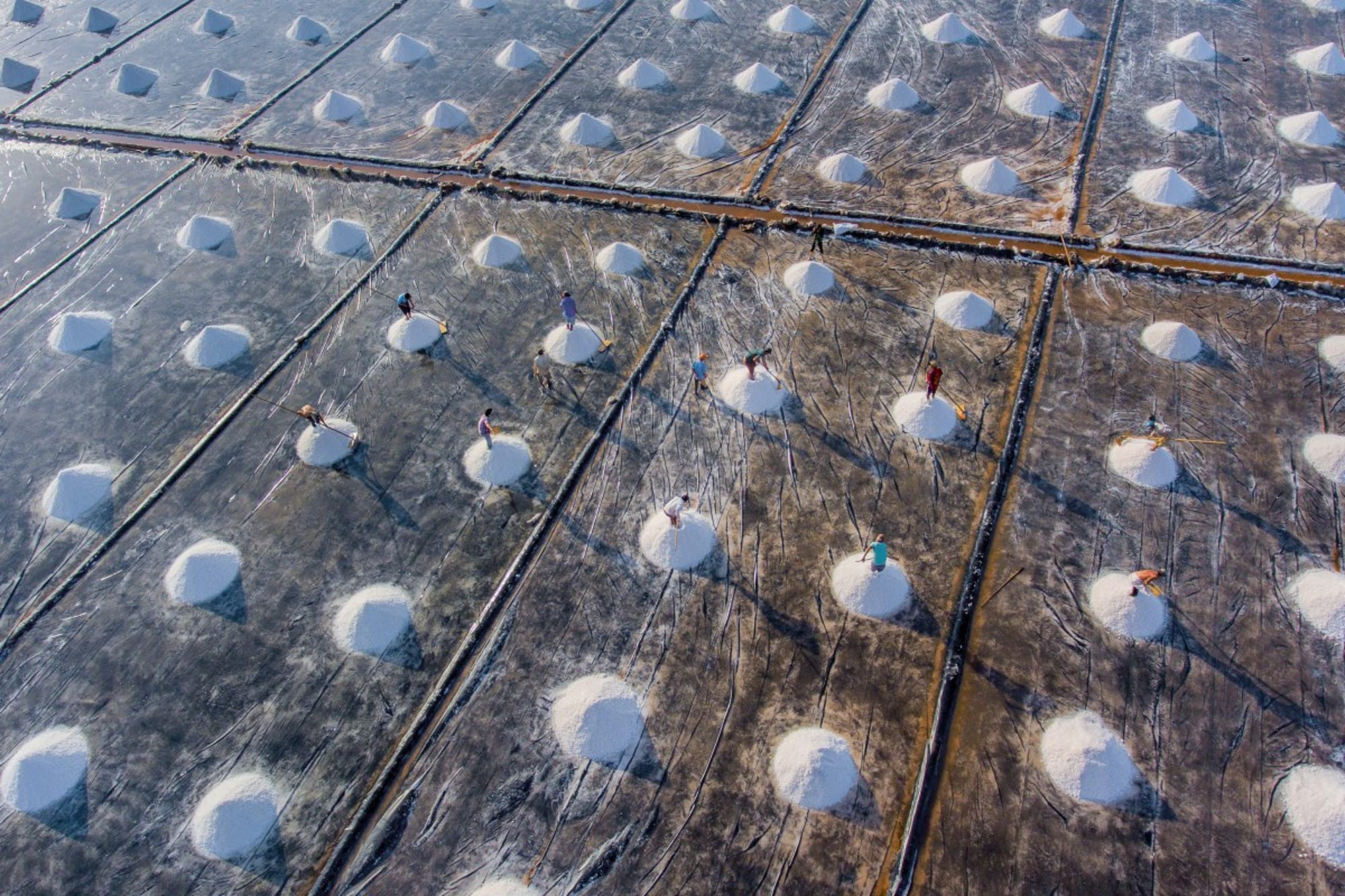 Workers ply their trade on the salt fields of Bac Lieu in the Mekong Delta, Vietnam(helios1412 Dronestagram).jpg