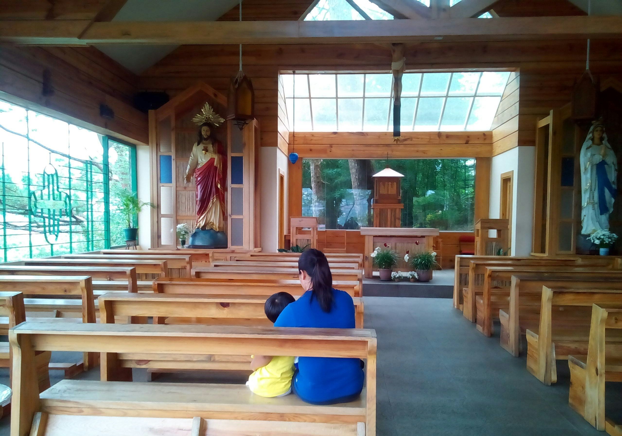 Family Praying inside the church.jpg