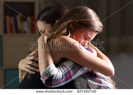 stock-photo-side-view-of-two-sad-good-friends-embracing-in-a-bedroom-in-a-house-interior-with-a-dark-light-in-627402740.jpg