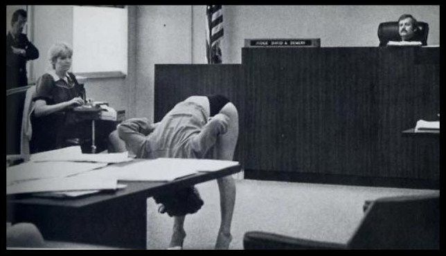 Stripper in Clearwater, FLA showing the judge that her bikini briefs were too large to expose her vagina to the undercover cops that arrested her. The case was dimissed..jpg