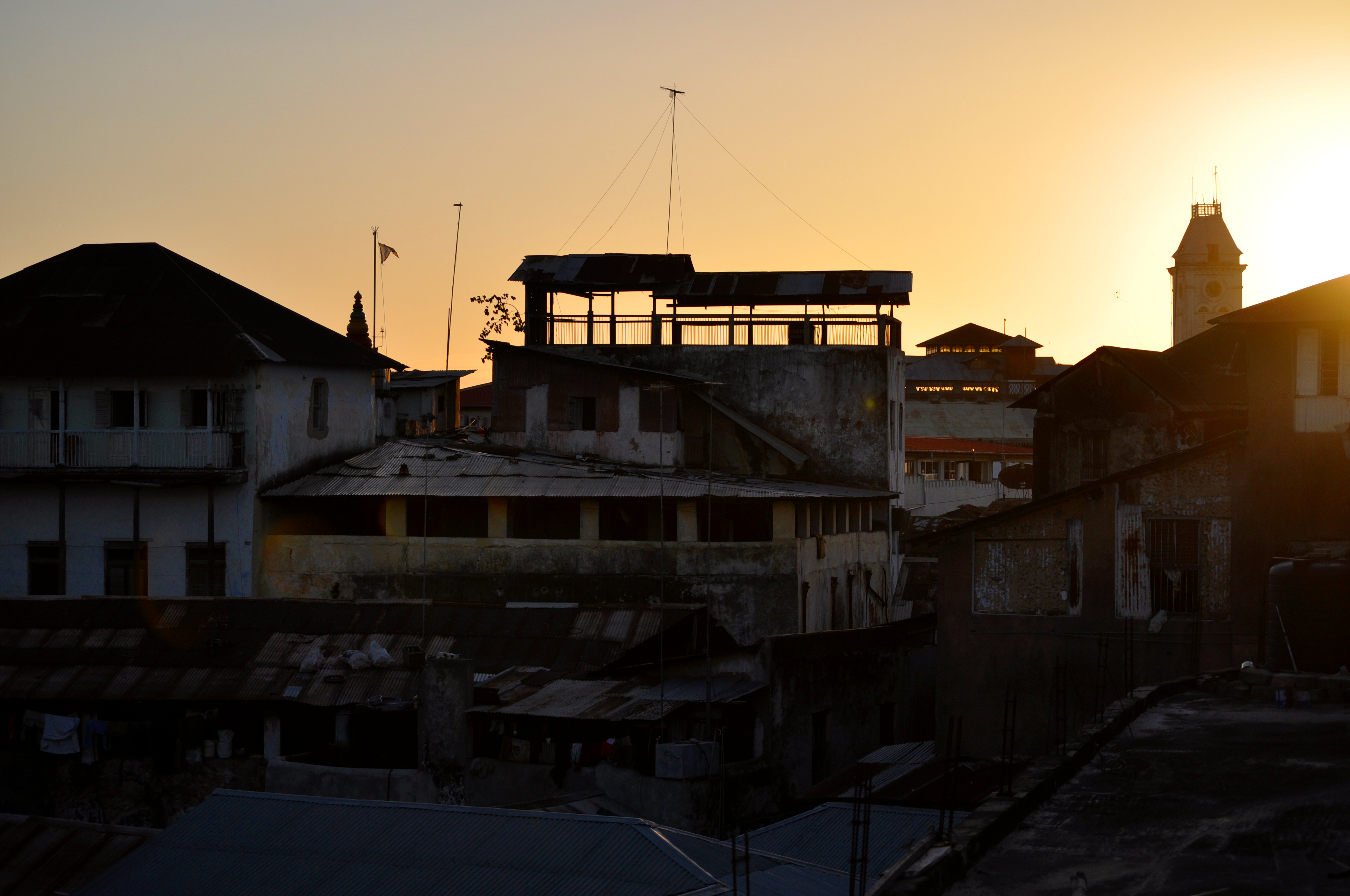 Stone Town sunset rooftops.png