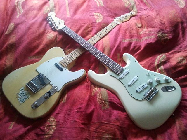 2 guitars crossed.jpg