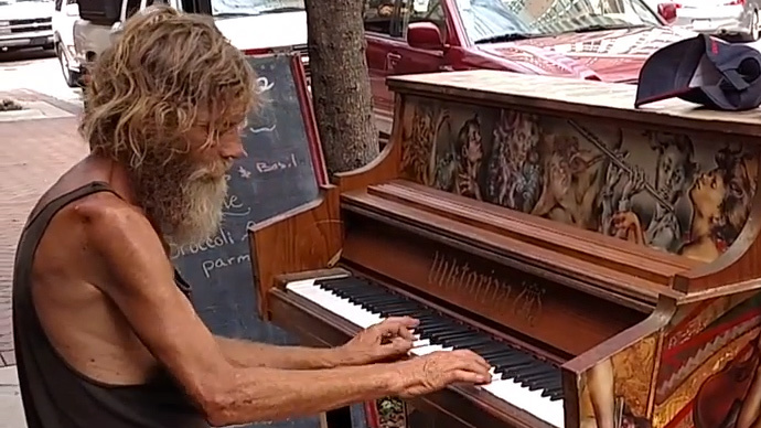 Homeless-man-playing-piano-on-the-street.jpg