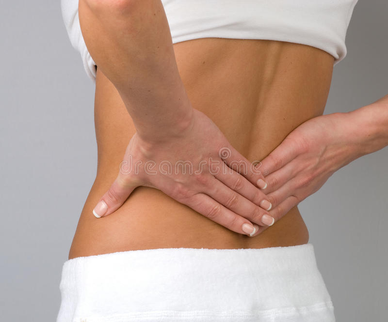 back-pain-woman-s-hands-pressing-against-her-lower-suggesting-30385389-1.jpg