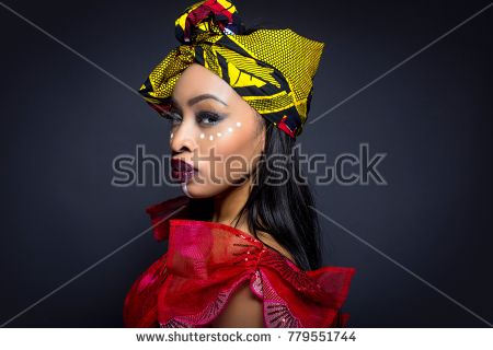 stock-photo-black-female-showing-african-pride-by-wearing-nigerian-traditional-clothing-and-tribal-makeup-or-779551744.jpg