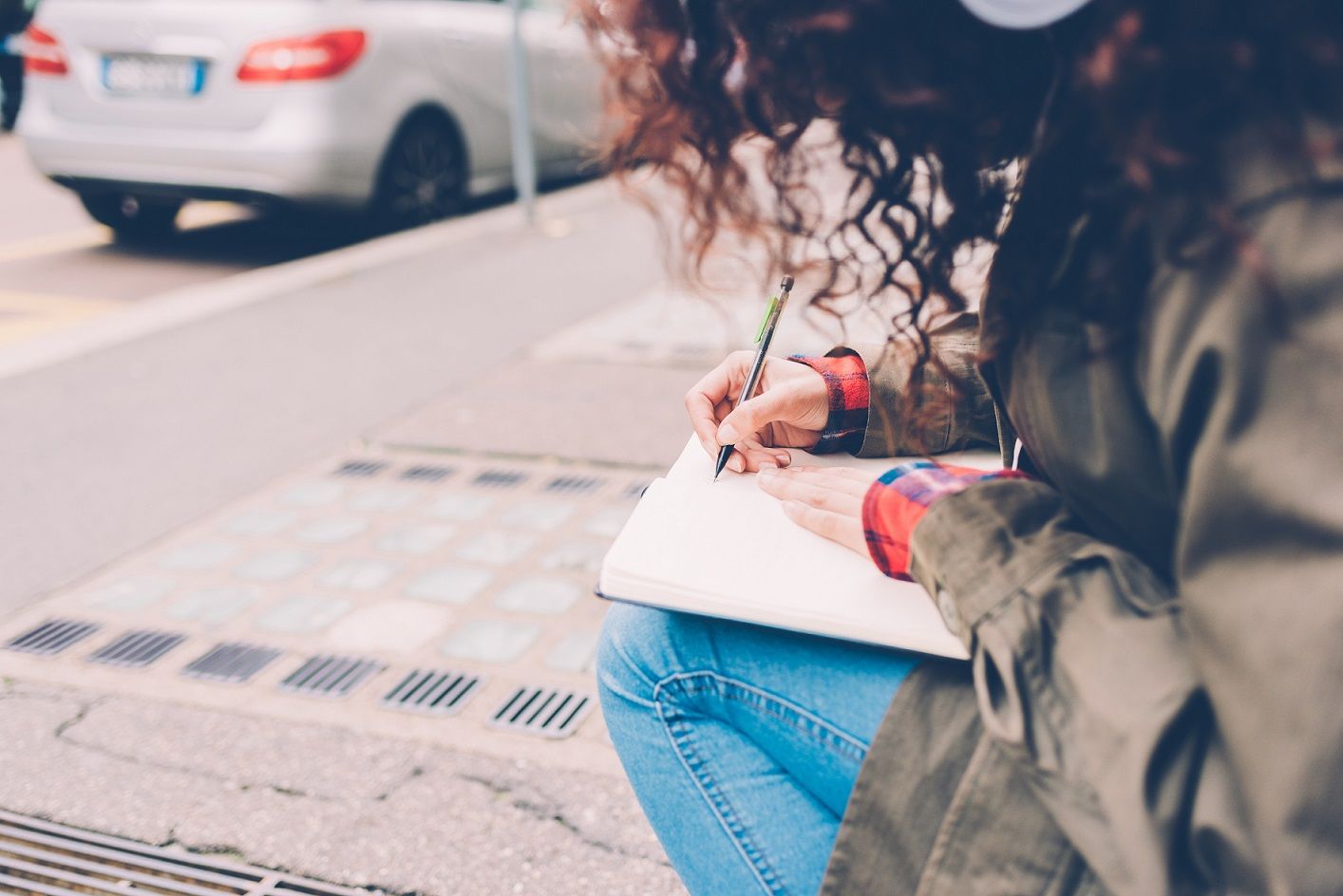 woman_writing_outside.jpg