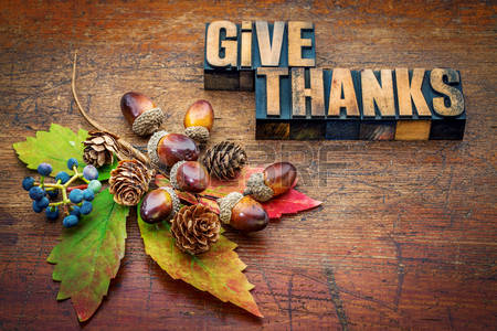 46177270-give-thanks-thanksgiving-concept-text-in-letterpress-wood-type-printing-blocks-with-cone-acorn-leaf-.jpg