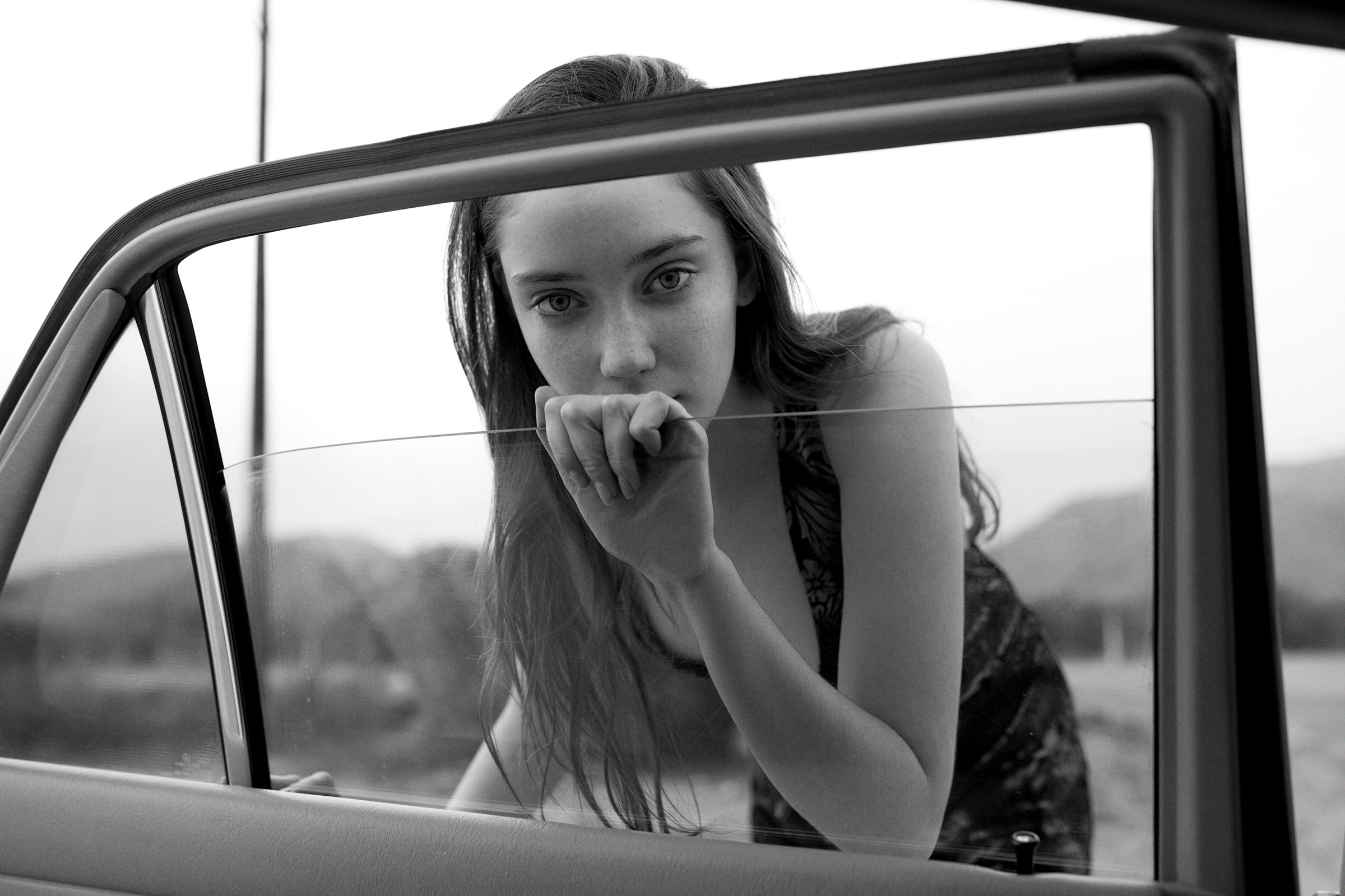 Chloe Bechtol of Nous Models Looking in window of 1990 mercedes 300se wearing Free People Romper photo by Amos Haley.jpg