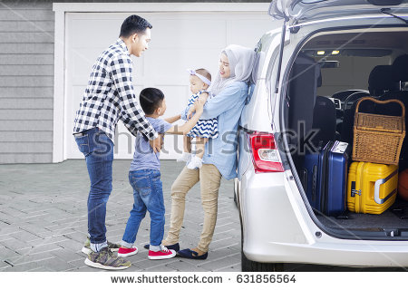 stock-photo-picture-of-muslim-parents-with-their-children-ready-to-trip-while-standing-near-a-car-in-the-house-631856564.jpg