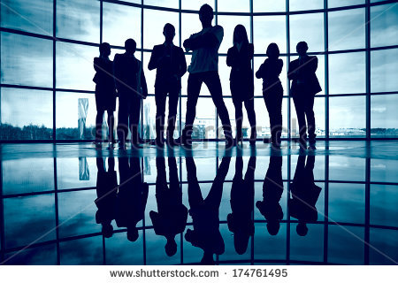 stock-photo-business-team-standing-against-window-with-leader-in-front-174761495.jpg