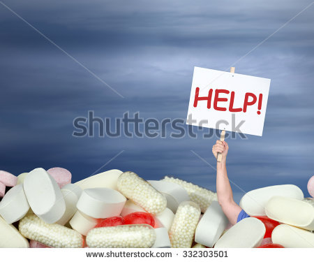 stock-photo-a-huge-pile-of-various-pills-with-a-man-s-hand-coming-out-of-the-pills-holding-a-sign-that-says-332303501.jpg