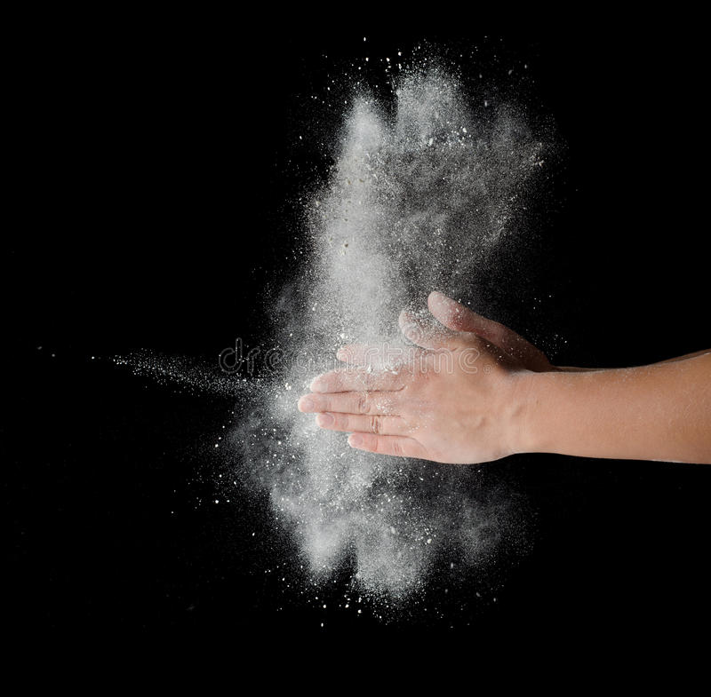 freeze-motion-dust-explosion-hands-isolated-black-background-33598694.jpg