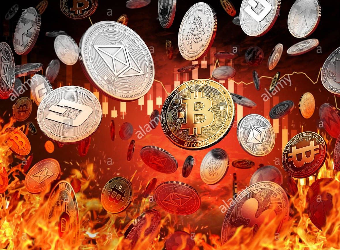 different-cryptocurrency-coins-are-falling-into-the-fire-decline-or-KHARC1.jpg