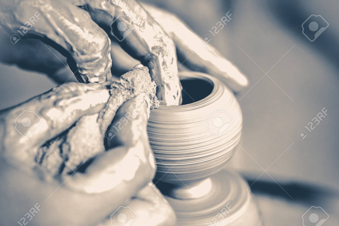 81038292-girl-sculpts-in-clay-pot-closeup-modeling-clay-close-up-caucasian-man-making-vessel-daytime-of-white-Stock-Photo.jpg