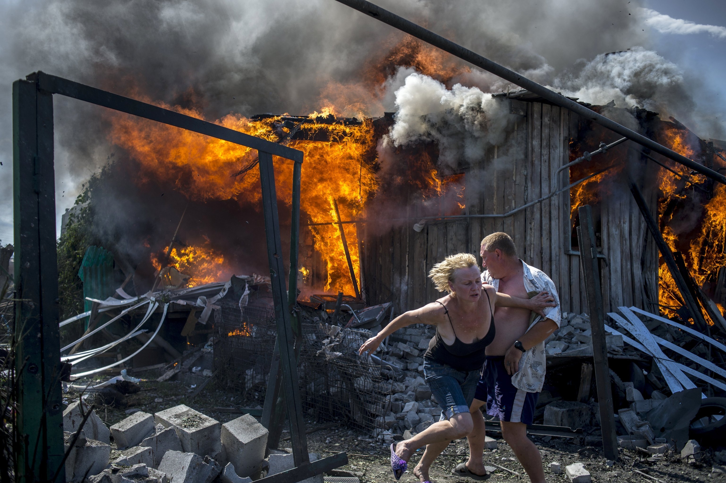 Donbass 4. Local residents escape from house destroyed by Ukrainian armed forces air attack, Luganskaya.jpg