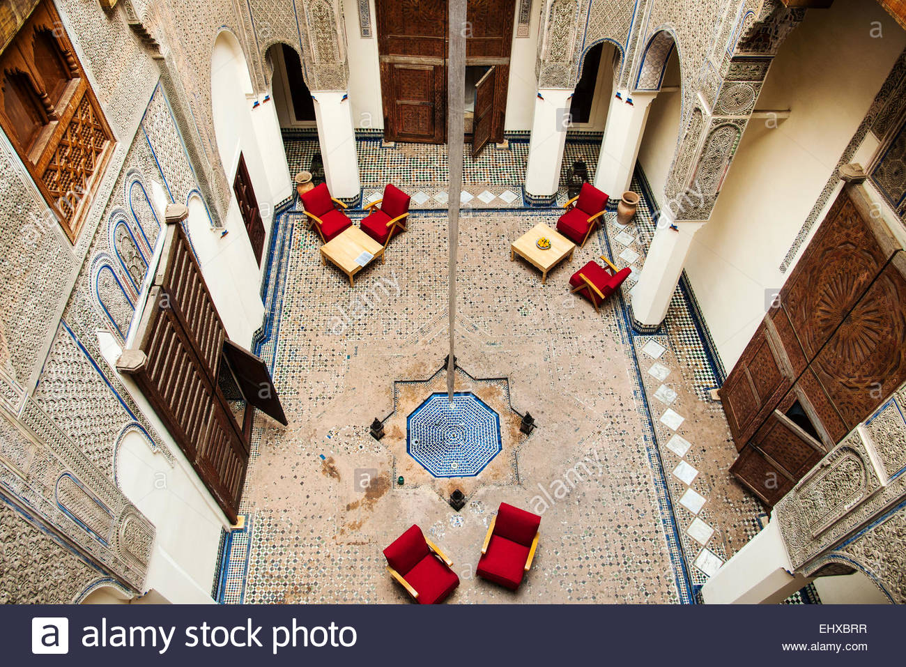 a-courtyard-of-the-traditional-moroccan-riad-or-traditional-house-EHXBRR.jpg