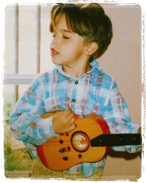 rhavi playing guitar child little.png