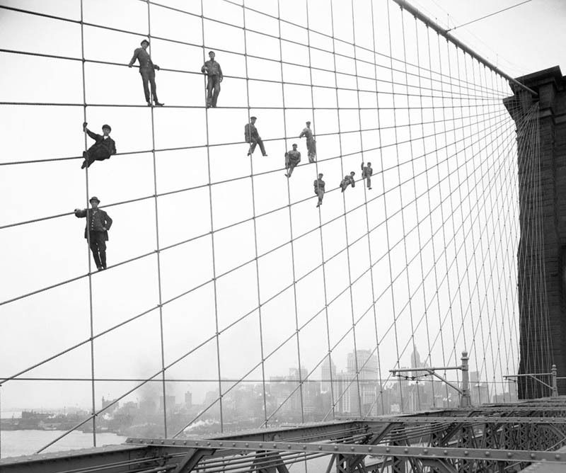 hanging-out-on-brooklyn-bridge-cables-black-and-white-old-vintage.jpg