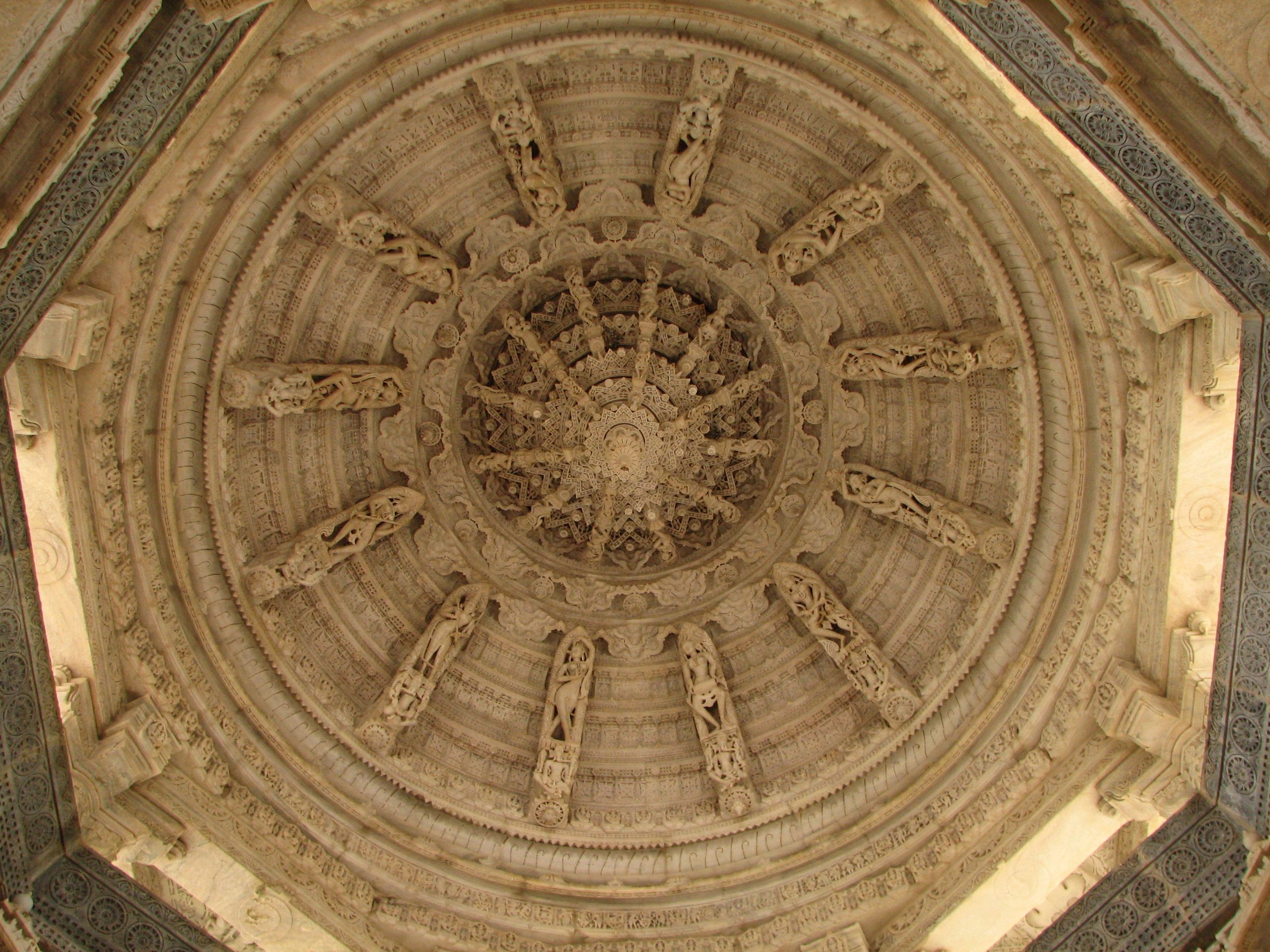 India_-_Udaipur_-_041_-_beautifully_carved_ceiling_at_the_Ranakpur_Jain_Temple_(1059176705).jpg