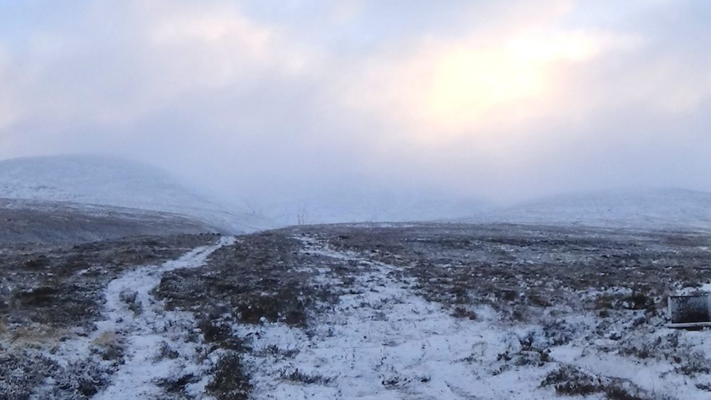 The snowy path ahead and hills.jpg