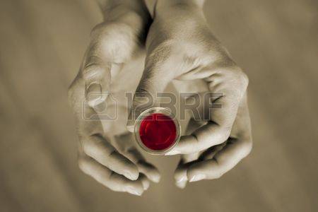 2856229-hands-holding-a-communion-cup-the-wine-is-red-and-the-rest-of-the-image-is-subdued-color.jpg