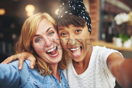 46416662-exuberant-happy-multi-ethnic-girl-friends-enjoying-a-hearty-laugh-as-they-face-the-camera-arm-in-arm.jpg