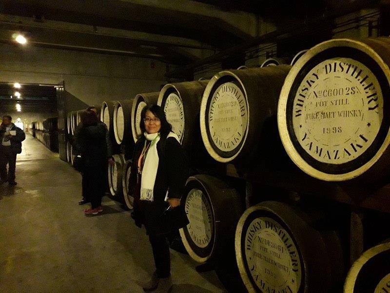 The writer inside the warehouse where casks were kept.  Some of them were produced way back since 1920s.jpg