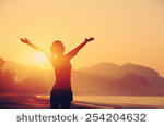stock-photo-strong-confidence-woman-open-arms-under-the-sunrise-at-seaside-254204632.jpg