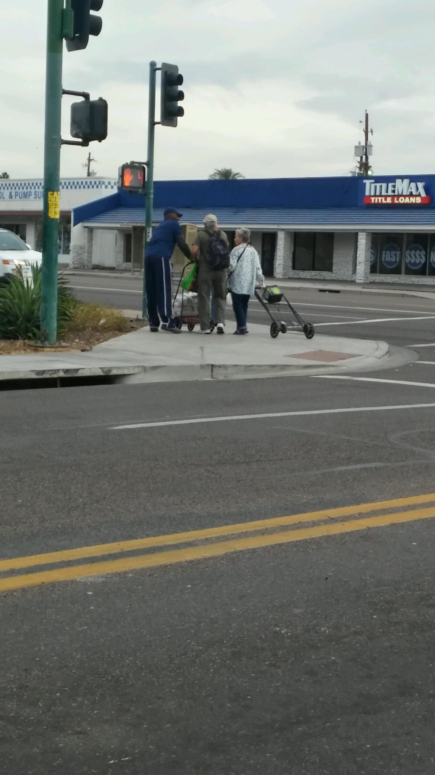 helping older couple cross the street.jpg