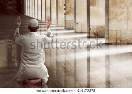 stock-photo-religious-muslim-man-praying-inside-the-mosque-414172375.jpg