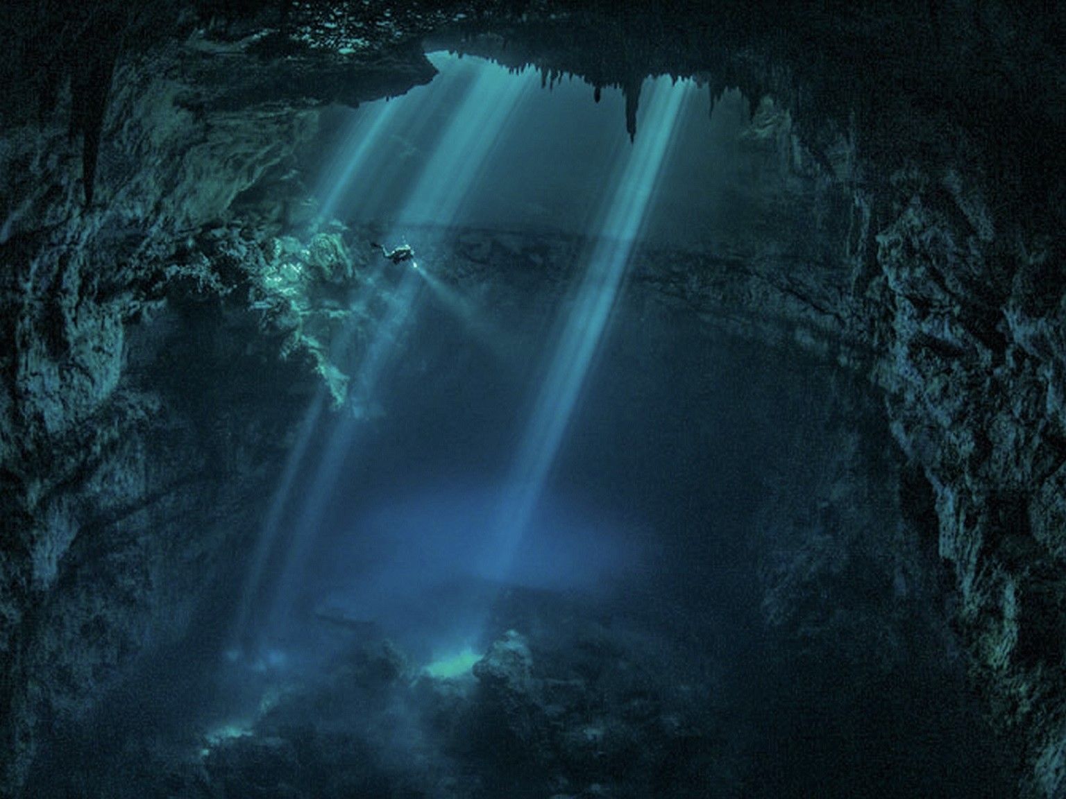 Edit-diver-explores-cenote-near-tulum.jpg