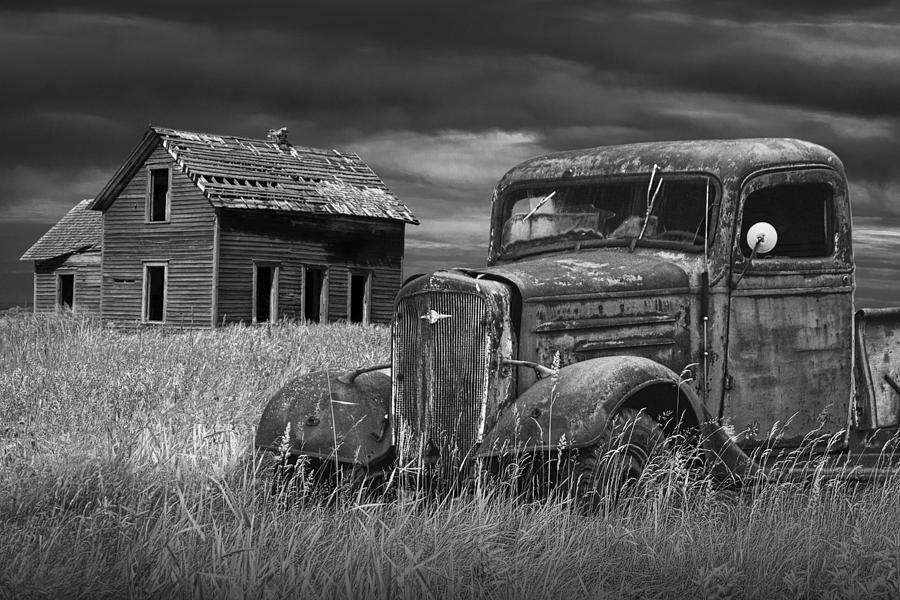 old-vintage-pickup-in-black-and-white-by-an-abandoned-farm-house-randall-nyhof.jpg
