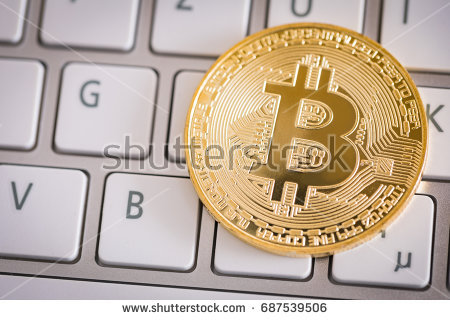 stock-photo-bitcoin-gold-coin-on-computer-keyboard-virtual-cryptocurrency-concept-687539506.jpg