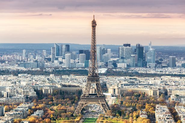 Sunset-on-Eiffel-tower-and-Defense-Paris-France.jpg