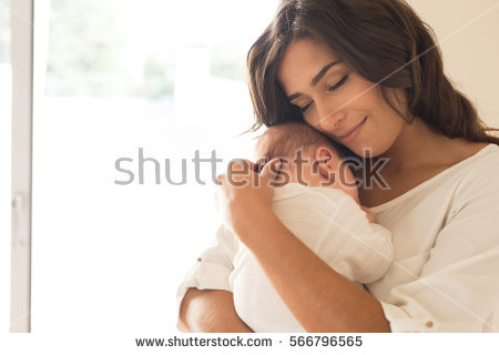 stock-photo-pretty-woman-holding-a-newborn-baby-in-her-arms-566796565.jpg