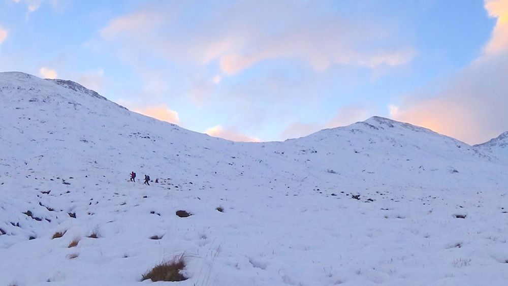 8 People heading up the snowy mountainside.jpg