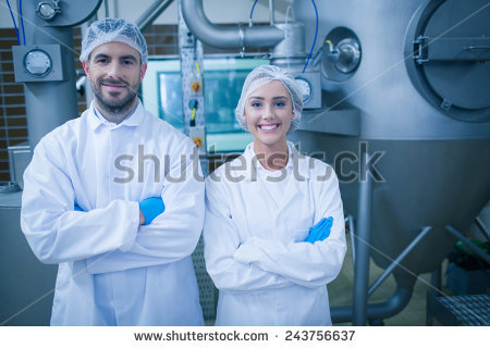 stock-photo-food-technicians-smiling-at-camera-in-a-food-processing-plant-243756637.jpg