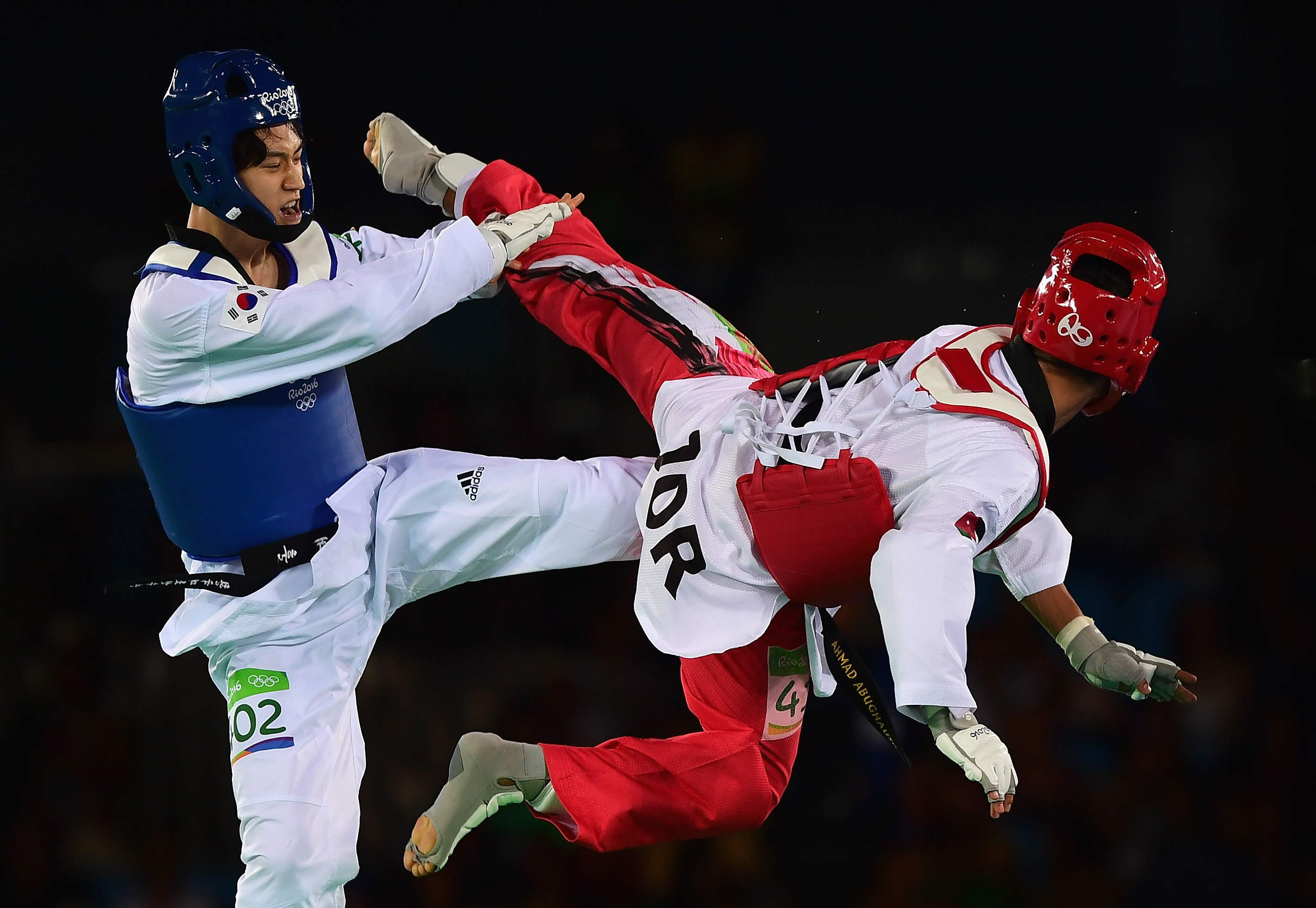 rio-de-janeiro-brazil---august-18--ahmed-abughaush-of-jordan-red-competes-against-daehoon-lee-of.jpeg