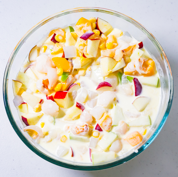 Filipino-Fruit-Salad-Pour-milk-and-cream-mixture-into-bowl-step-5.jpg