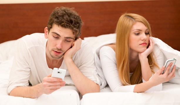 bigstock-Young-couple-with-smartphones-64976827-613x358.jpg