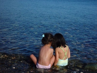 two-girls-river-lake-sea.jpg