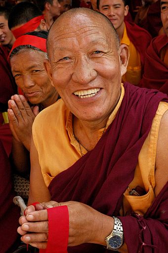 Very_happy_Tibetan_Buddhist_Monk.jpg