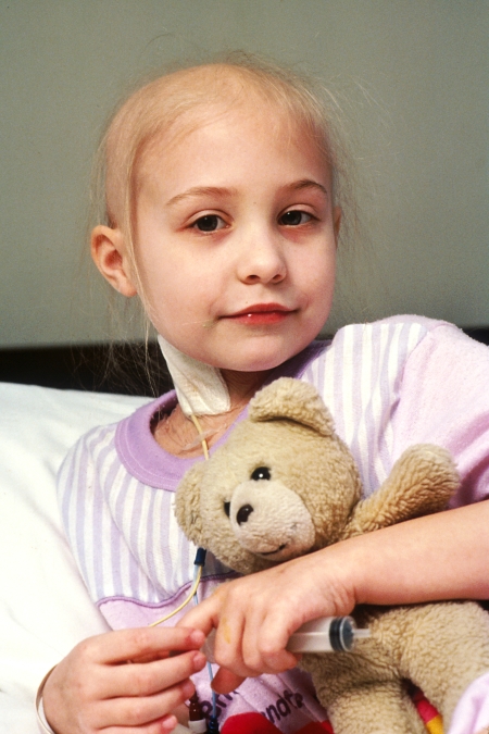 Young_patient_holds_teddy_bear.jpg