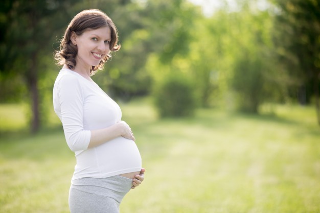 happy-pregnant-woman-on-late-pregnancy-stage-posing-in-park_1163-1668.jpg
