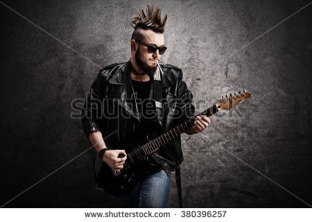 stock-photo-young-punk-rocker-playing-electric-guitar-and-leaning-against-a-concrete-wall-380396257.jpg
