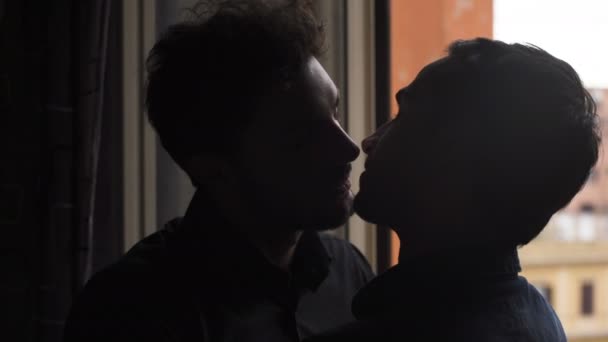 depositphotos_155521282-stock-video-gay-men-silhouette-kissing-sweetly.jpg